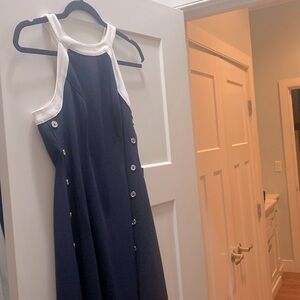 Tommy Hill finger size 6 petite navy blue side buttons flared bottom Never worn